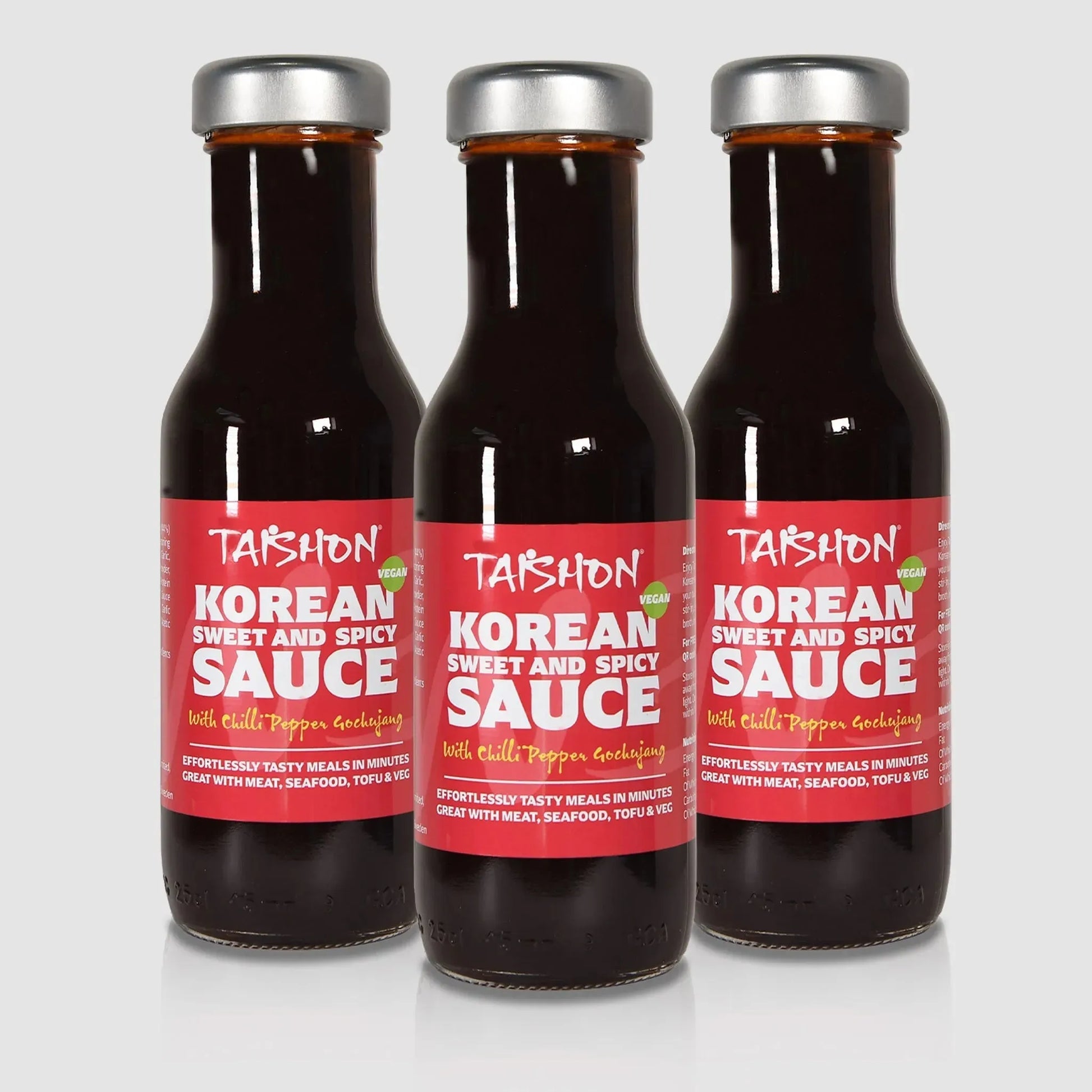 Half case of three Taishon Korean sweet and spicy vegan sauce bottles, ideal for cooking and marinating.
