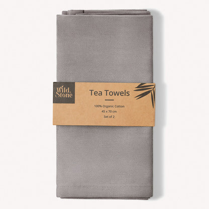 Set of two Wild and Stone organic cotton tea towels with herringbone weave, showcasing their textured, natural fabric.