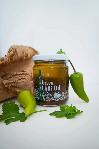 Laffe sustainable green chilli oil bottle with vibrant green chili peppers and oil in clear glass container.