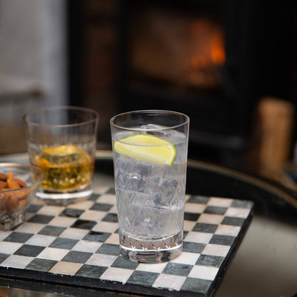 Crystal highball glass with a lattice design by The Vintage List, showcasing intricate cut patterns for elegant drink presentation.