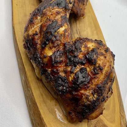 FireFly Barbecue Louisiana Spicy Cajun BBQ Rub in a jar, with vibrant red Cajun spices and herbs visible.