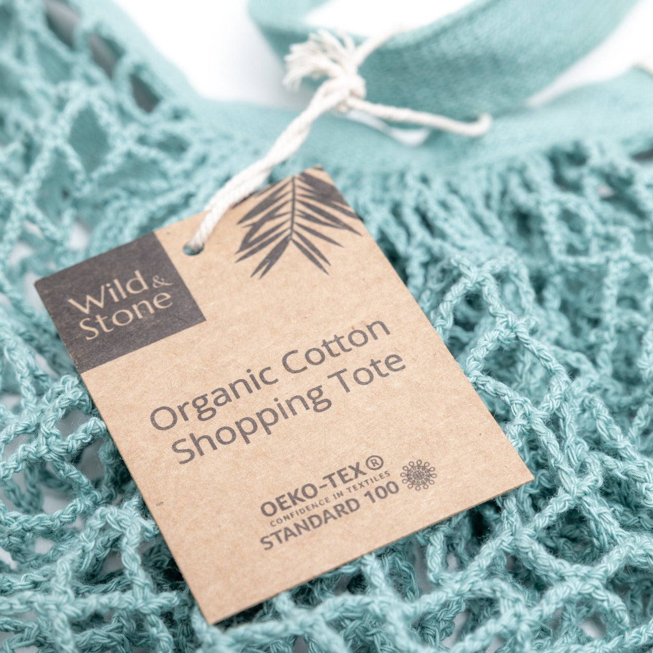 Blue organic cotton crochet tote bag by Wild And Stone, featuring a spacious design and handcrafted details.