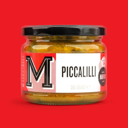Jar of Manfood Chunky Piccalilli vegetable relish with visible chunky vegetables in a glass jar.