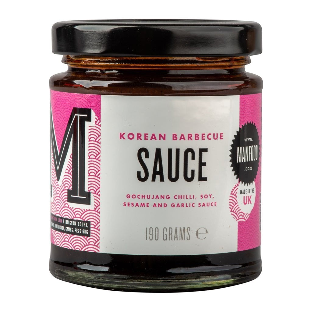Bottle of Manfood Korean Barbecue Sauce, thick and flavorful sauce with a red label and pouring spout, on a neutral background.