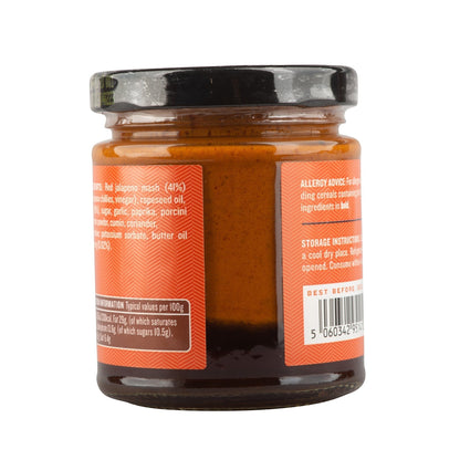 Manfood Vegan Buffalo Sauce with butter flavor, featuring chili and onion ingredients in a sauce bottle.