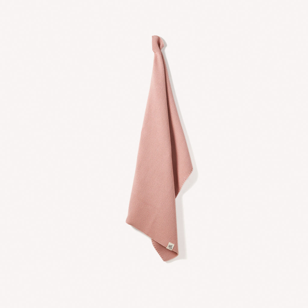 Soft organic cotton hand towels by Wild And Stone, featuring a textured weave and natural neutral tones.