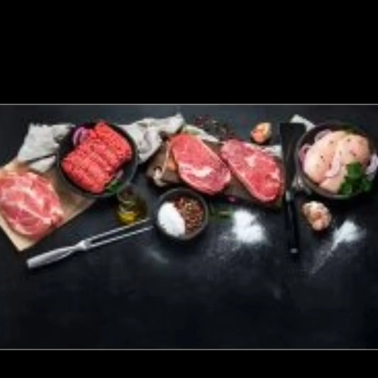 Primrose Herd Essentials Meat Box featuring grass-fed, outdoor-reared meats with a variety of cuts in a neatly arranged box.