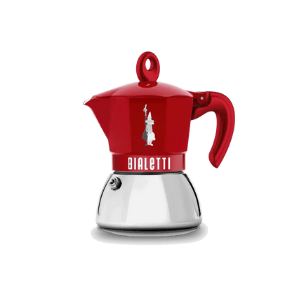 Red Bialetti Moka Induction Exclusive coffee maker with two cups, made by Brew Italia, featuring a sleek stovetop design.