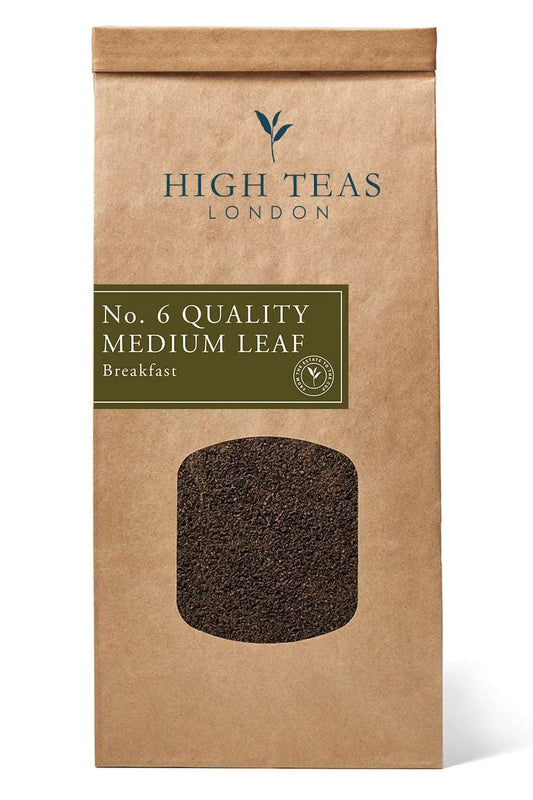 Loose leaf English Breakfast Blend tea, Quality Medium Leaf by High Teas, displayed in a tea tin with medium-sized tea leaves.