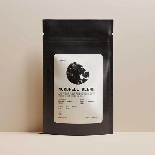 Nordfell roasted coffee blend in a 1kg bag, showcasing rich coffee beans with a dark roast appearance.