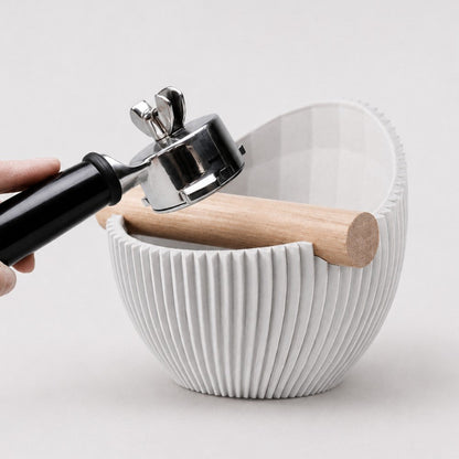 KNOCDIC® Nova Sculptural Espresso Knock Box in use, featuring a sleek, modern design for coffee grounds disposal.