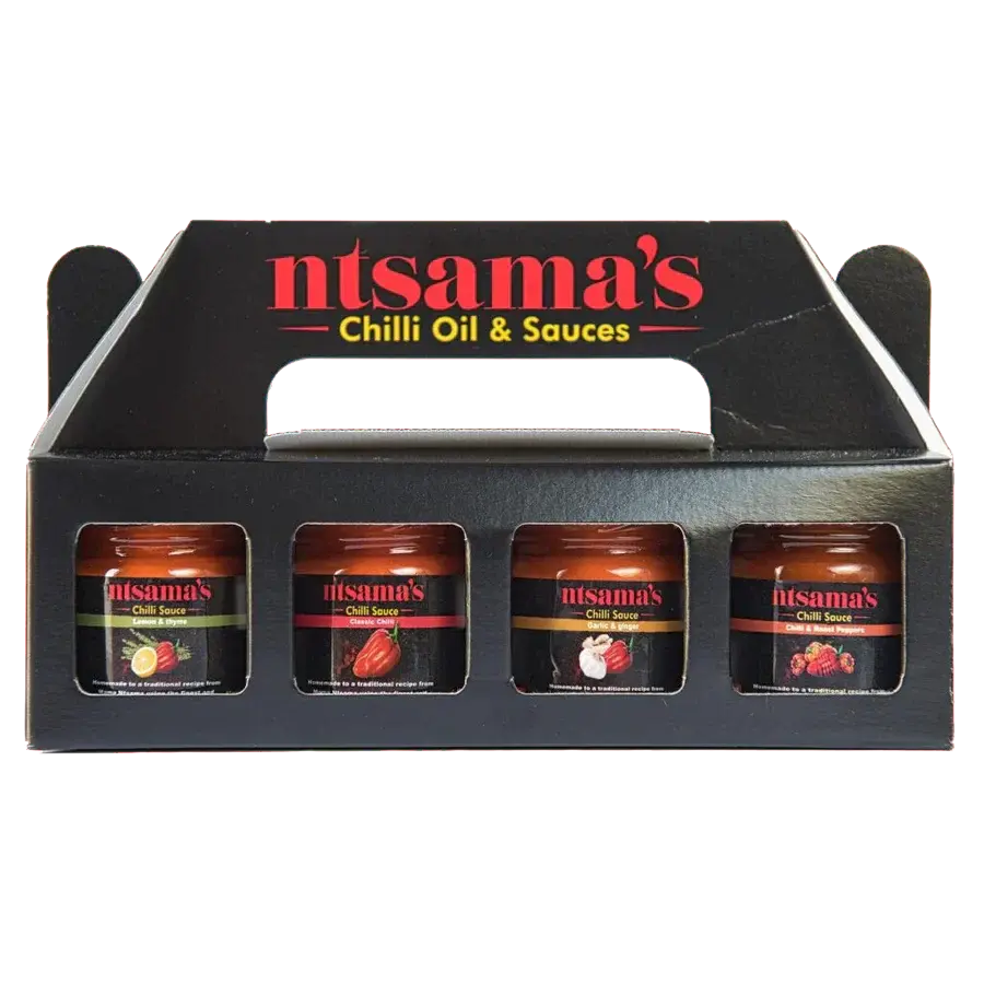 Mini chilli sauce taster set from ntsama.co.uk featuring small bottles of vibrant, spicy chilli sauces on a wooden tray.