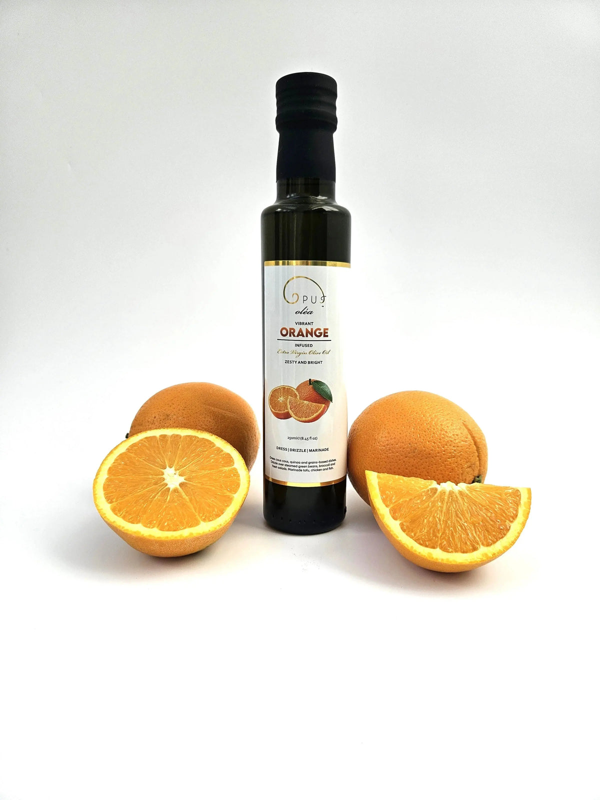 Opus Oléa Orange Greek extra virgin olive oil in a 250ml bottle, with a bright orange label and a clear glass container.