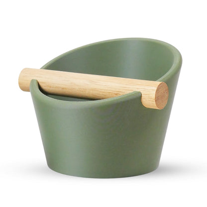 Oval Coffee Knock Box by KNOCDIC® with a sleek olive green finish and a real oak wood bar for espresso puck disposal.