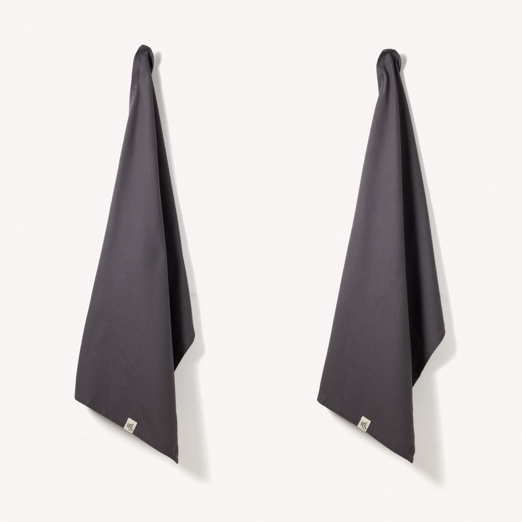 Set of two Wild and Stone organic cotton tea towels with herringbone weave, featuring a soft, absorbent fabric and classic design.