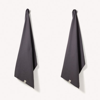 Set of two Wild and Stone organic cotton tea towels with herringbone weave, featuring a soft, absorbent fabric and classic design.