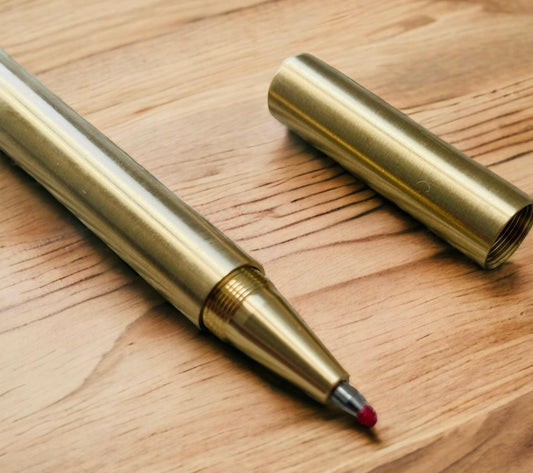 Matte brass gel ink ballpoint pen from Artizan Market UK with box and two refills, stylish writing instrument for gifts.
