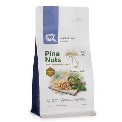 Whole Food Earth pine nuts, a type of nuts and seeds, shown in a 3D image with natural light highlighting their small, oval shape.