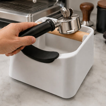 KNOCDIC® Pod Coffee Knock Box in use, with a barista knocking used coffee pods into the container for easy disposal.