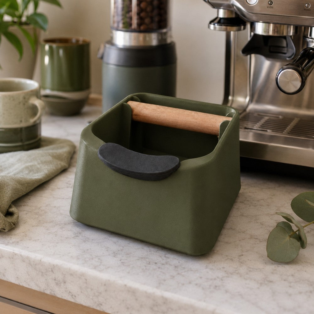KNOCDIC® The Pod coffee knock box in a modern kitchen, featuring a stainless steel drum for used coffee grounds.