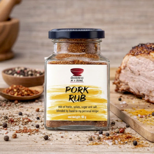 Close-up of GOODNESS IN A BOWL pork rub in a jar, showcasing the seasoned spice blend for grilling and barbecue.