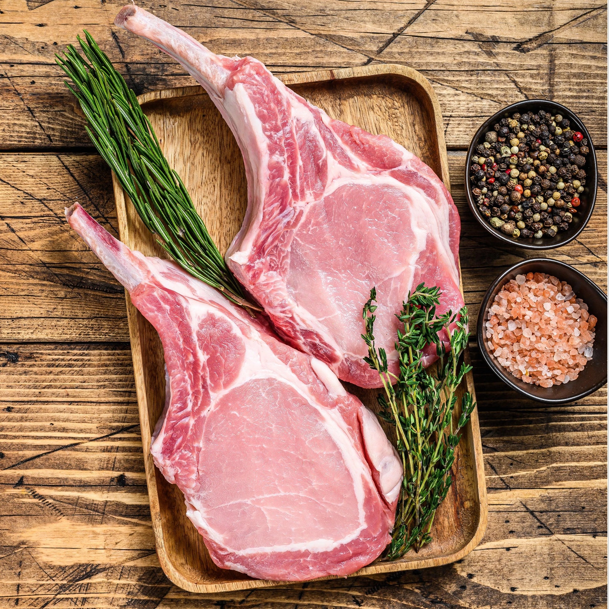 French-trimmed pork cutlets from Primrose Herd, fresh pork chops with cleanly trimmed edges ready for cooking.