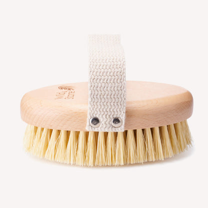 Wild and Stone natural bristle dry body brush with wooden handle for exfoliating and invigorating skin care.