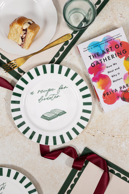 Avalon Home UK Recipe For Disaster Bone China Plate featuring colorful cake and dessert illustrations on a white background.