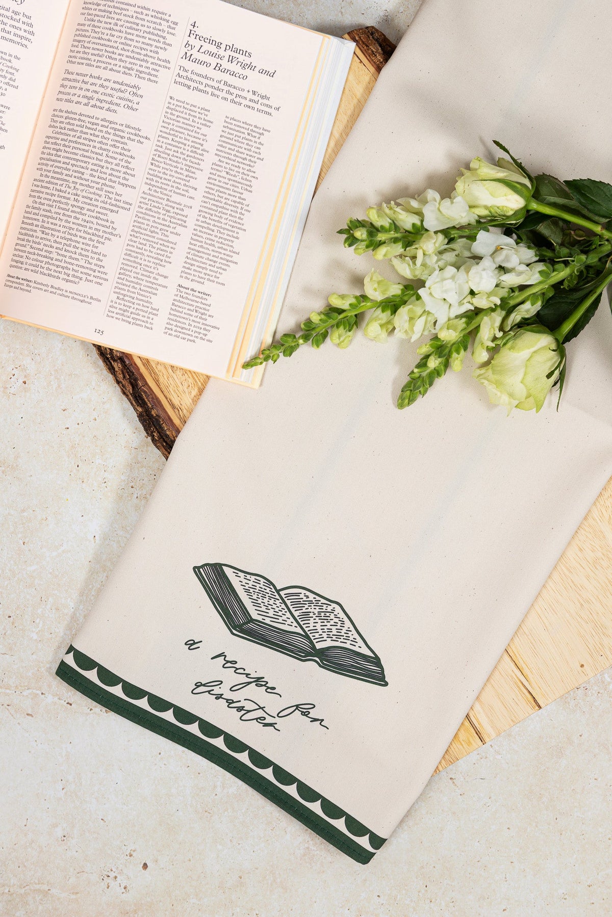 Avalon Home UK Recipe For Disaster Bone China Plate, featuring a detailed design, displayed on a table with a matching teatowel.