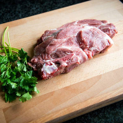 Primrose Herd Cornish outdoor-reared pork spare rib chops, 500g, showing juicy, bone-in pork chops with marbled meat and crispy edges.