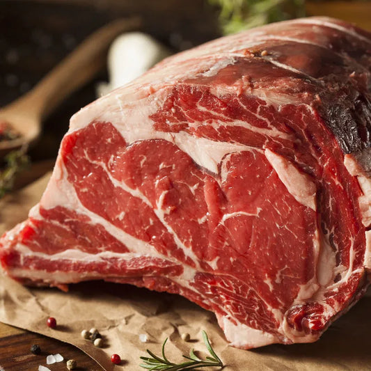 Prime Primrose Herd dry aged rib of beef joint, showing a beautifully roasted beef rib with a caramelized crust and bone.
