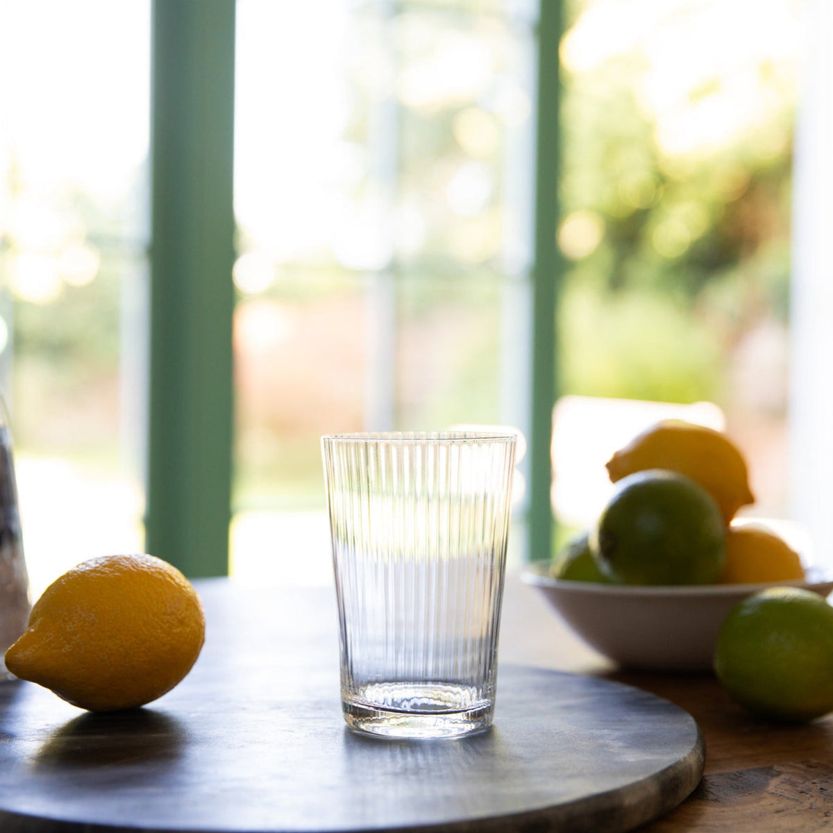 Clear crystal tumbler with a ripple design, showcasing elegant craftsmanship and textured surface, by The Vintage List.