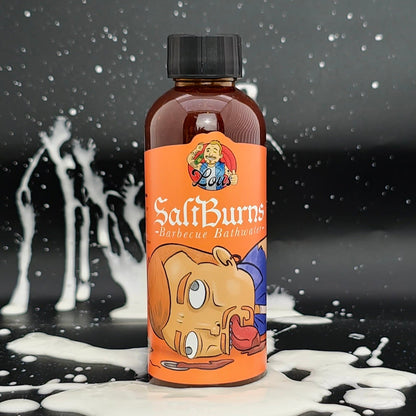 Bottle of Saltburns Barbecue Bathwater hot sauce from Lou's Brews, featuring a label with bold lettering and colorful design.