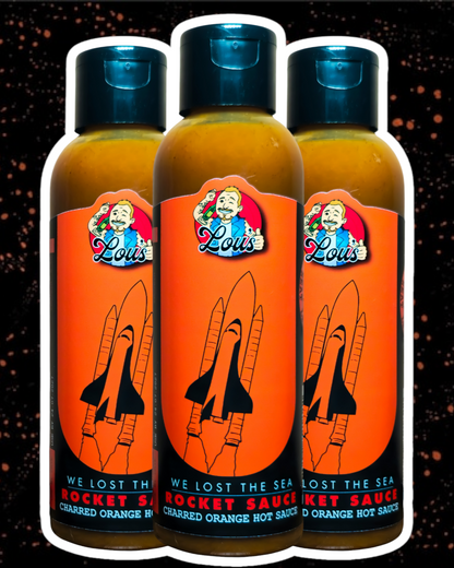 Lou's Brews Rocket Sauce Charred Orange condiment bottle, spicy hot sauce with vibrant orange label and bold branding.