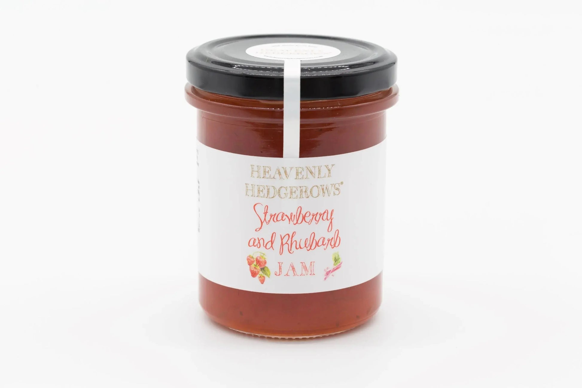 Heavenly Hedgerows strawberry and rhubarb jam in a glass jar with fresh fruit and rhubarb stalks on a rustic background.
