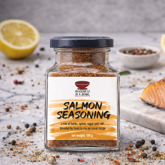 Salmon seasoning rub from Goodness in a Bowl, with herbs and spices, perfect for enhancing salmon fillets during cooking.