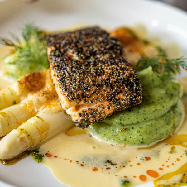 Salmon seasoning rub from GOODNESS IN A BOWL, featuring a spice blend in a jar for flavorful salmon preparation.