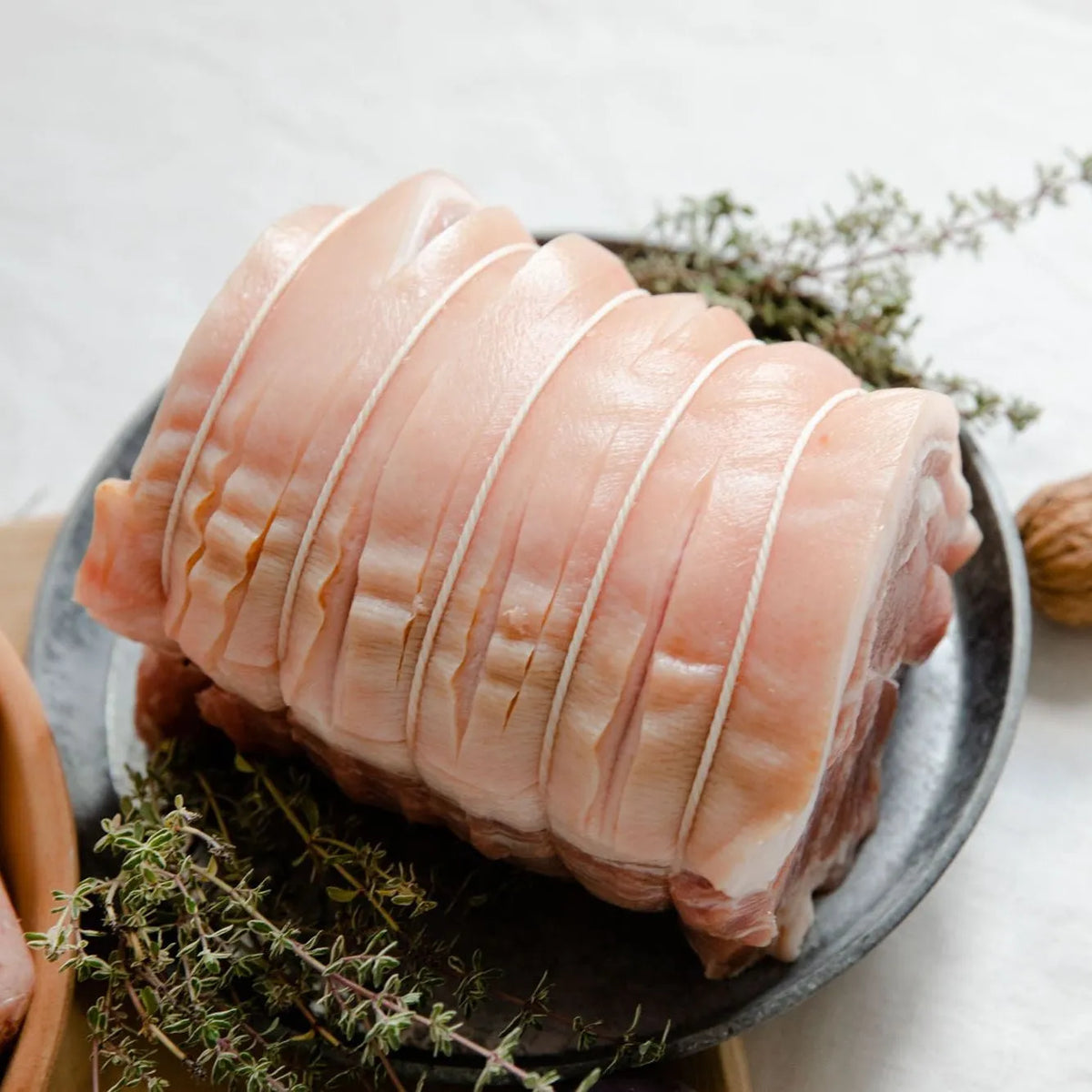 Boneless, rolled Cornish outdoor-reared pork shoulder joint by Primrose Herd, ready for roasting, weighing 1-4kg.