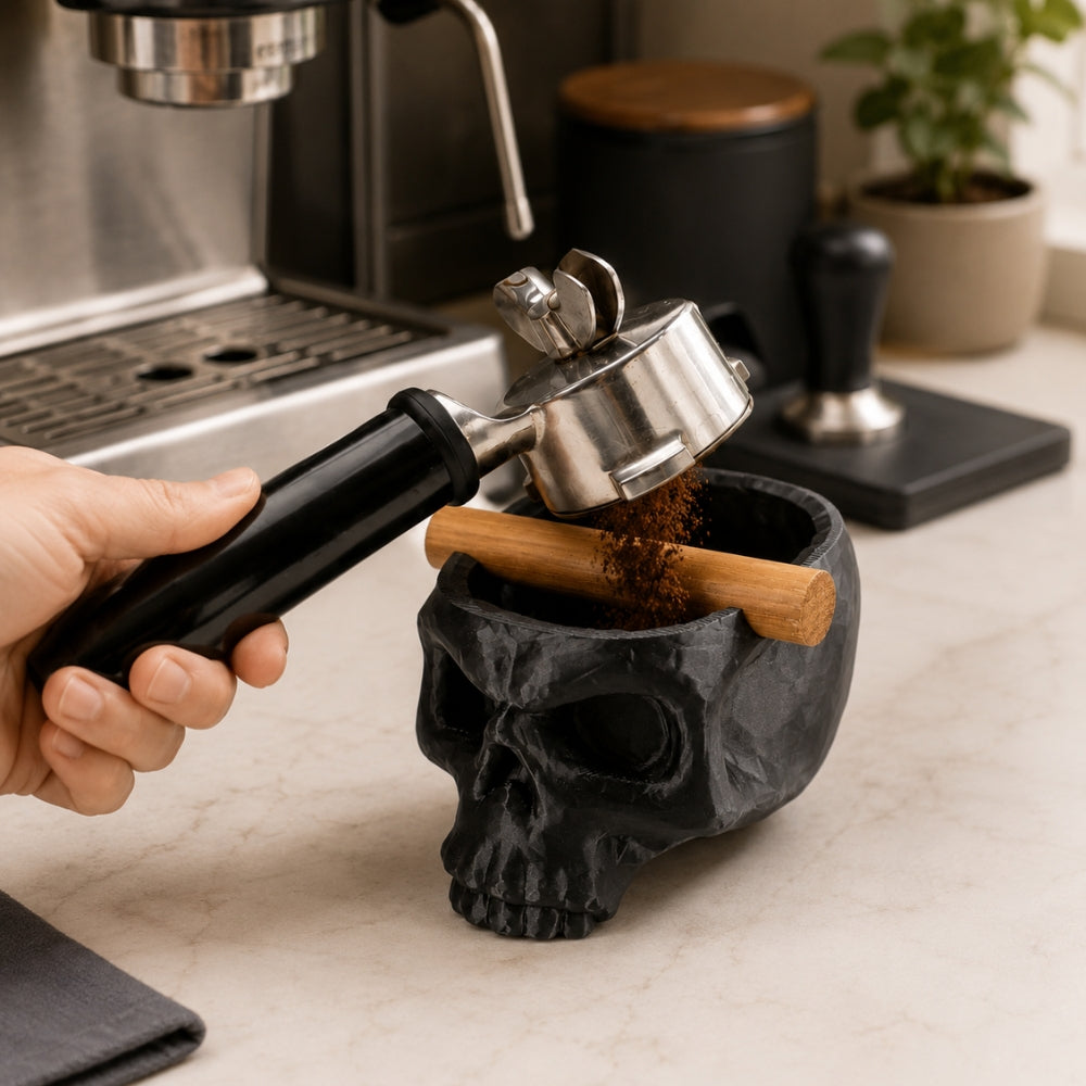 KNOCDIC® Gothic Skull Espresso Knock Box with Oak Bar for coffee grounds, black skull design in use on espresso machine countertop.