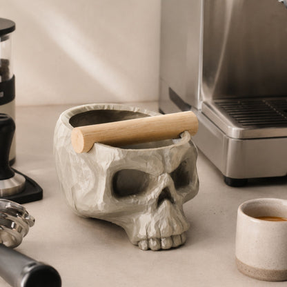 Gothic skull espresso knock box with oak bar by KNOCDIC®, featuring a dark skull design and sturdy wooden bar for coffee grounds.