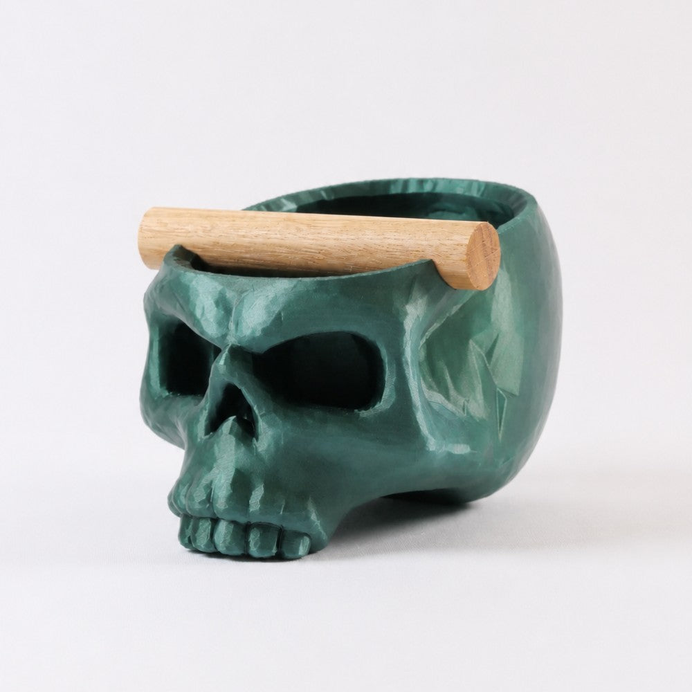 KNOCDIC® Gothic skull espresso knock box with metallic green finish and oak bar for coffee grounds disposal.