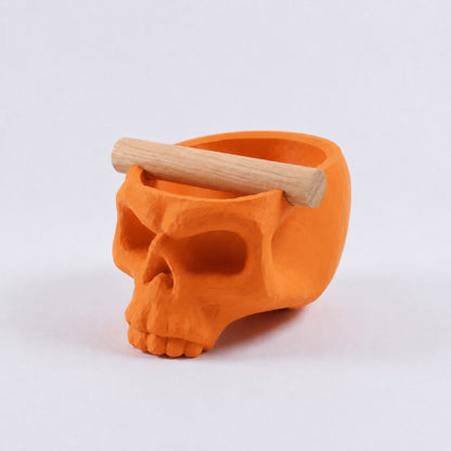 Gothic skull espresso knock box with orange finish and oak bar from KNOCDIC® for coffee grounds disposal.