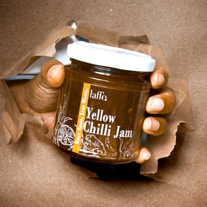 Small jar of Laffe Sustainable Yellow Chilli Jam, a vibrant chili sauce with a bright yellow color and fresh chili pieces visible.