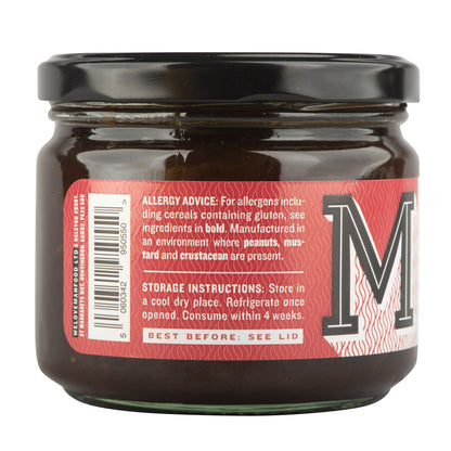 Manfood Smoky Onion Relish in a glass jar, showcasing dark, caramelized onions with a smoky flavor, ready to serve.
