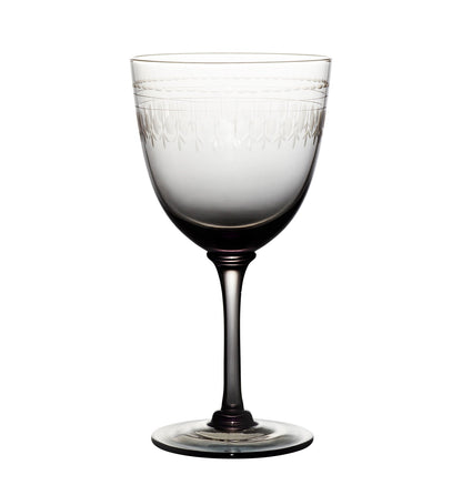 four smoky crystal wine glasses with ovals design