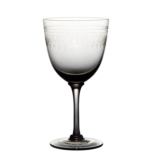 four smoky crystal wine glasses with ovals design