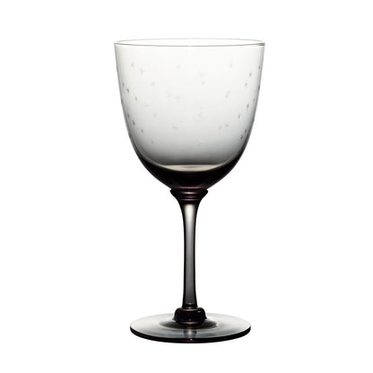 four smoky crystal wine glasses with stars design