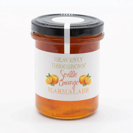 Heavenly Hedgerows Seville Orange Marmalade in a jar with visible orange slices and glossy marmalade texture.