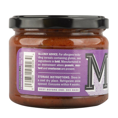 Manfood Spiced Tomato Chutney in a jar, showing its rich, chunky texture and vibrant red color, perfect for pairing with meals.