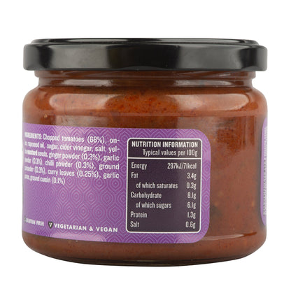 Jar of Manfood Spiced Tomato Chutney with visible fresh tomatoes and spices, showcasing its rich, flavorful ingredients.